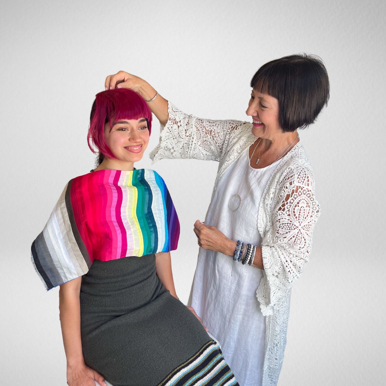 Image consultant using the hair bang kit in red hair colour on a client during a colour analysis