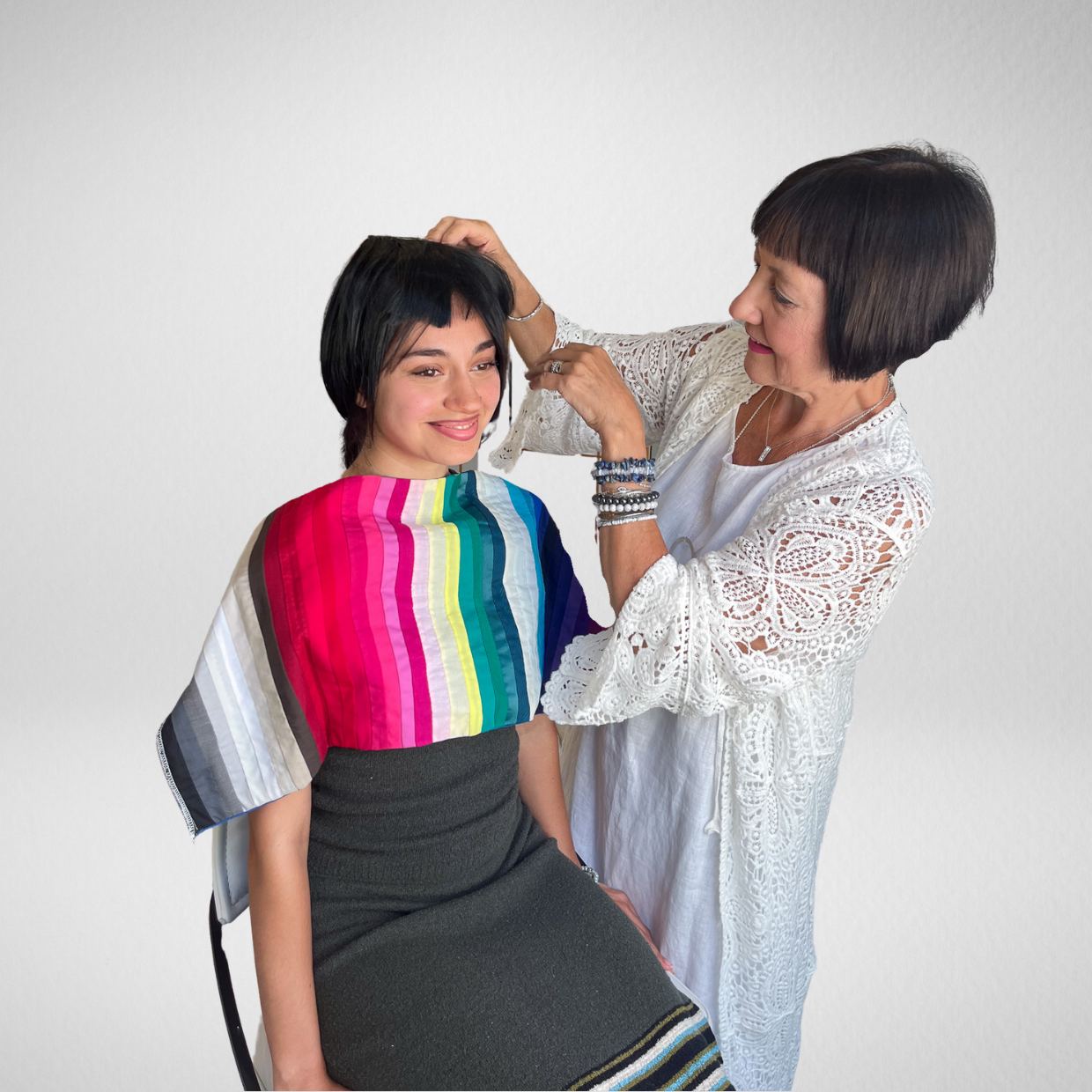 Image consultant using the hair bang kit in black hair colour on a client during a colour analysis